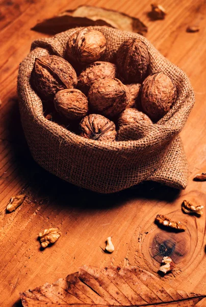 Walnut in burlap sack — Stock Photo, Image