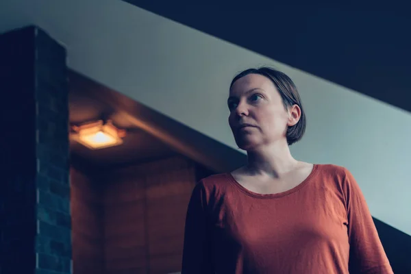 Sad woman in loft apartment — Stock Photo, Image