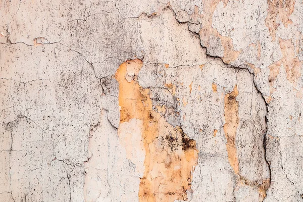 Старая потрескавшаяся поверхность стены в качестве фона — стоковое фото