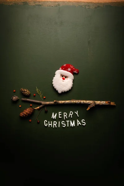 Merry Christmas text flat lay top view on green background — Stock Photo, Image