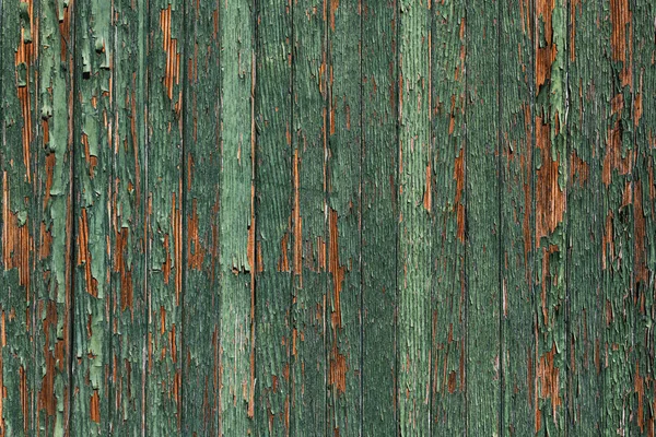 Green paint peeling of rustic wooden surface — Stock Photo, Image