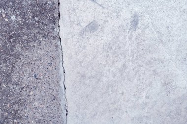 Arkaplan olarak parlak çatlamış beton yüzey döşeme dokusu