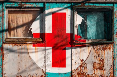 Old ambulance wagon with red cross sign