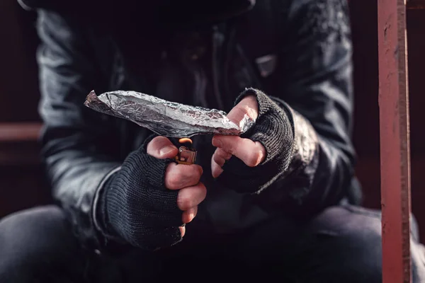Drug addict smoking opium on tin foil — Stock Photo, Image