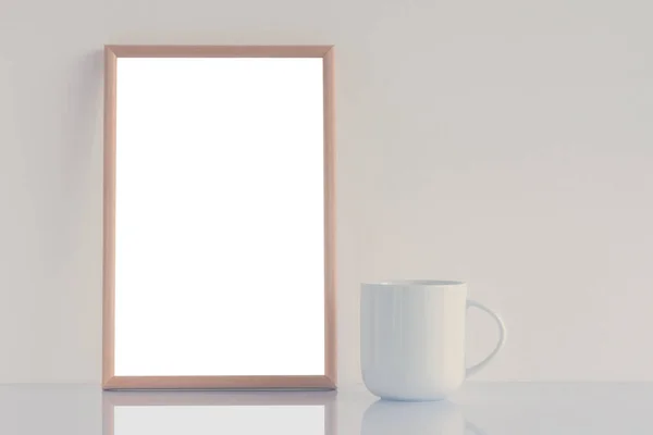 White coffee cup and blank picture frame mock up — Stock Photo, Image