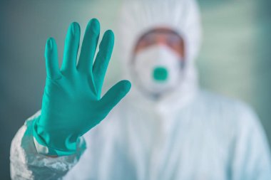 Epidemiyoloji uzmanı Coronavirus karantinasında el işaretini durdurun diyor.