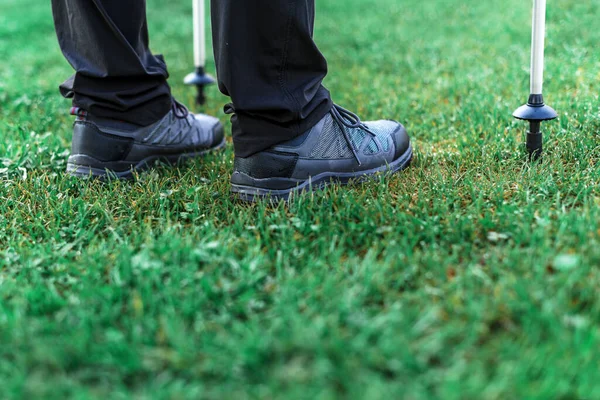 Hiking Poles Shoes Close Selective Focus Sportsperson Standing Grass Preparing — Stock Photo, Image