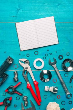 Plumbing tools and blank notebook mock up, top view flat lay clipart