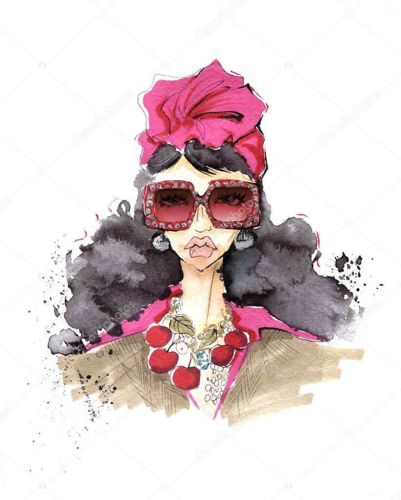 Portrait of a girl in a trendy turban and sunglasses.