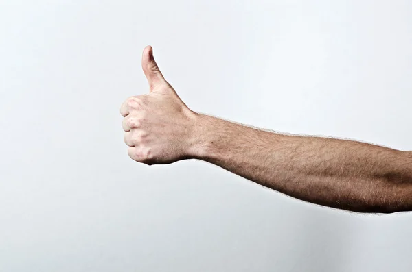 Arm of a Young Fit Adult Male with Thumbs Up Sign — Stock Photo, Image