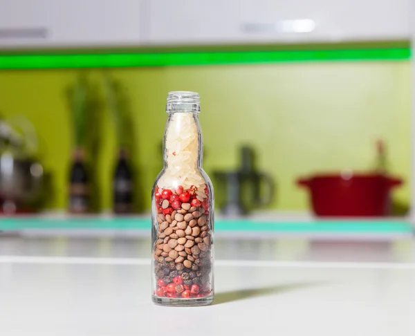 Bottle with different grits and berries — Stock Photo, Image