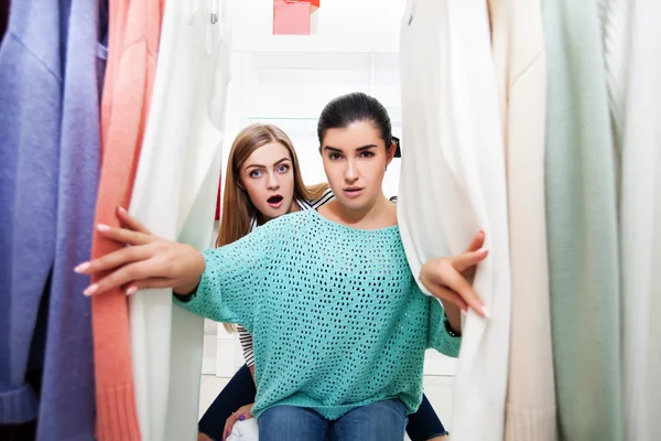 Women near stand with pull-overs — Stock Photo, Image