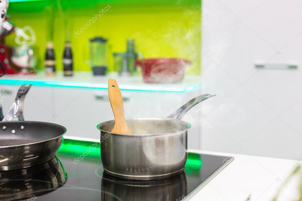 Pot on stove in kitchen — Stock Photo © Nomadsoul1 126420438