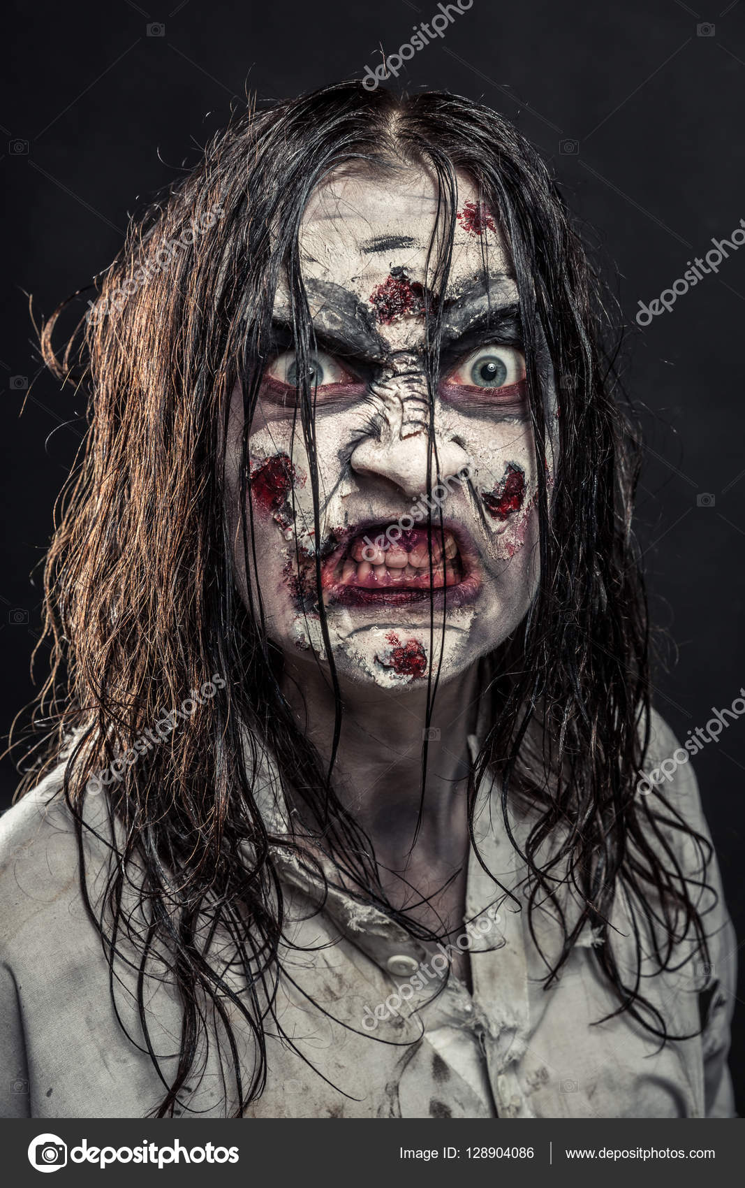 Portrait Of A Scared Girl With Blood On Her Face Looking At Camera