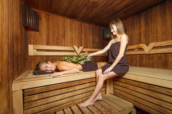 Laughing girls in sauna — Stock Photo, Image