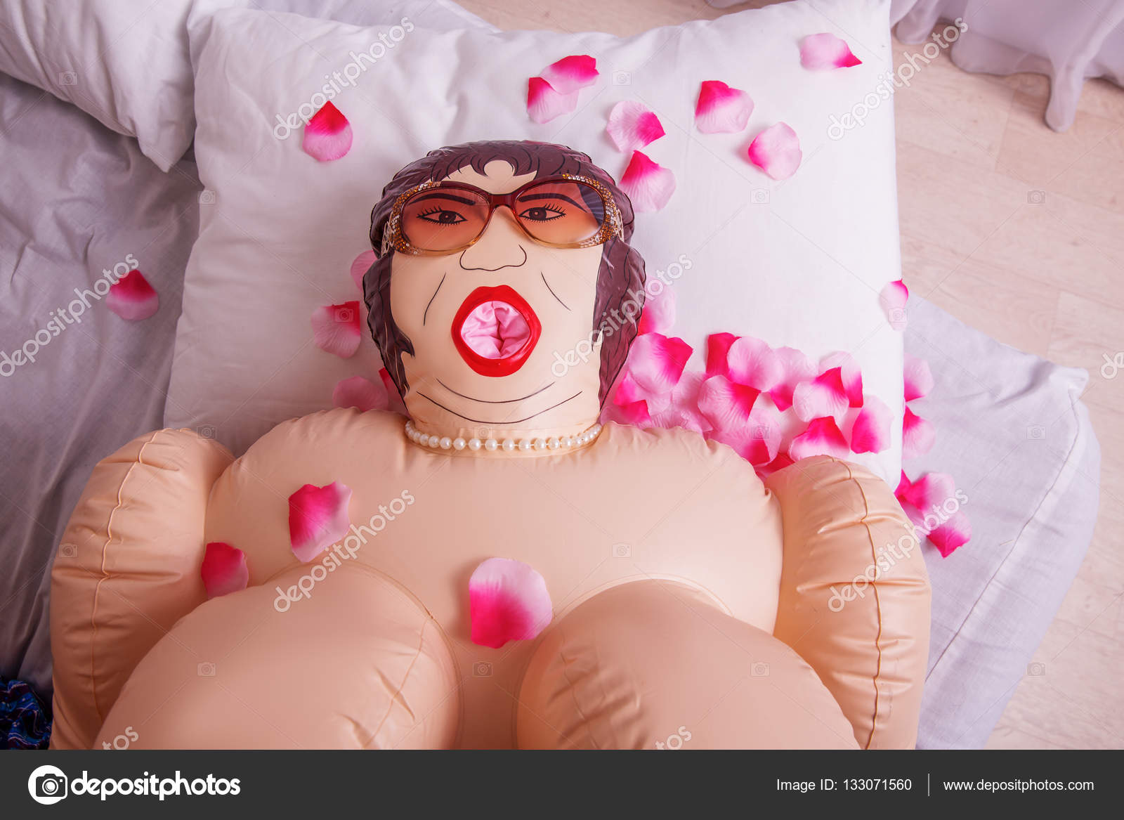 depositphotos_133071560-stock-photo-inflatable-sex-doll-strewed-with.jpg