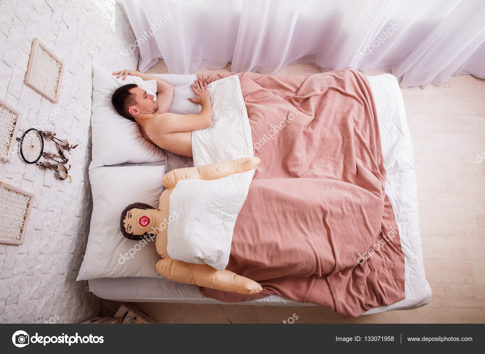 Man sleeping in bed with sex doll Stock Photo by ©Nomadsoul1 133071958