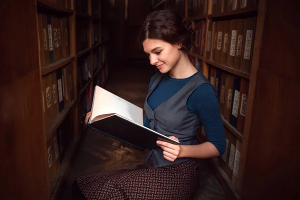Young woman in university library — Stock Photo, Image