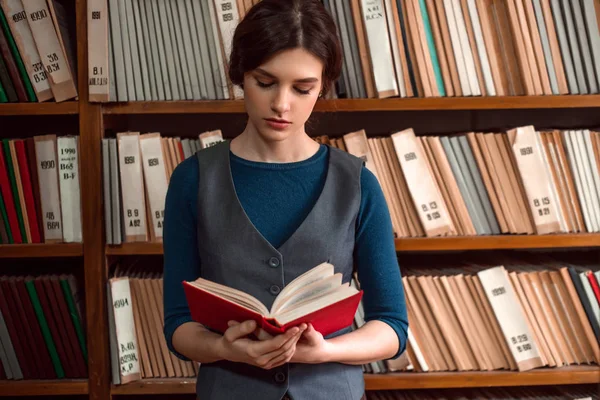 Young woman in university library — Stock Photo, Image
