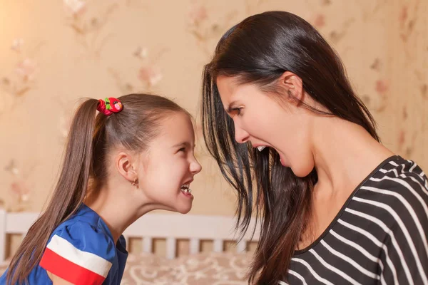 Mother and daughter showing scary faces — Stock Photo, Image