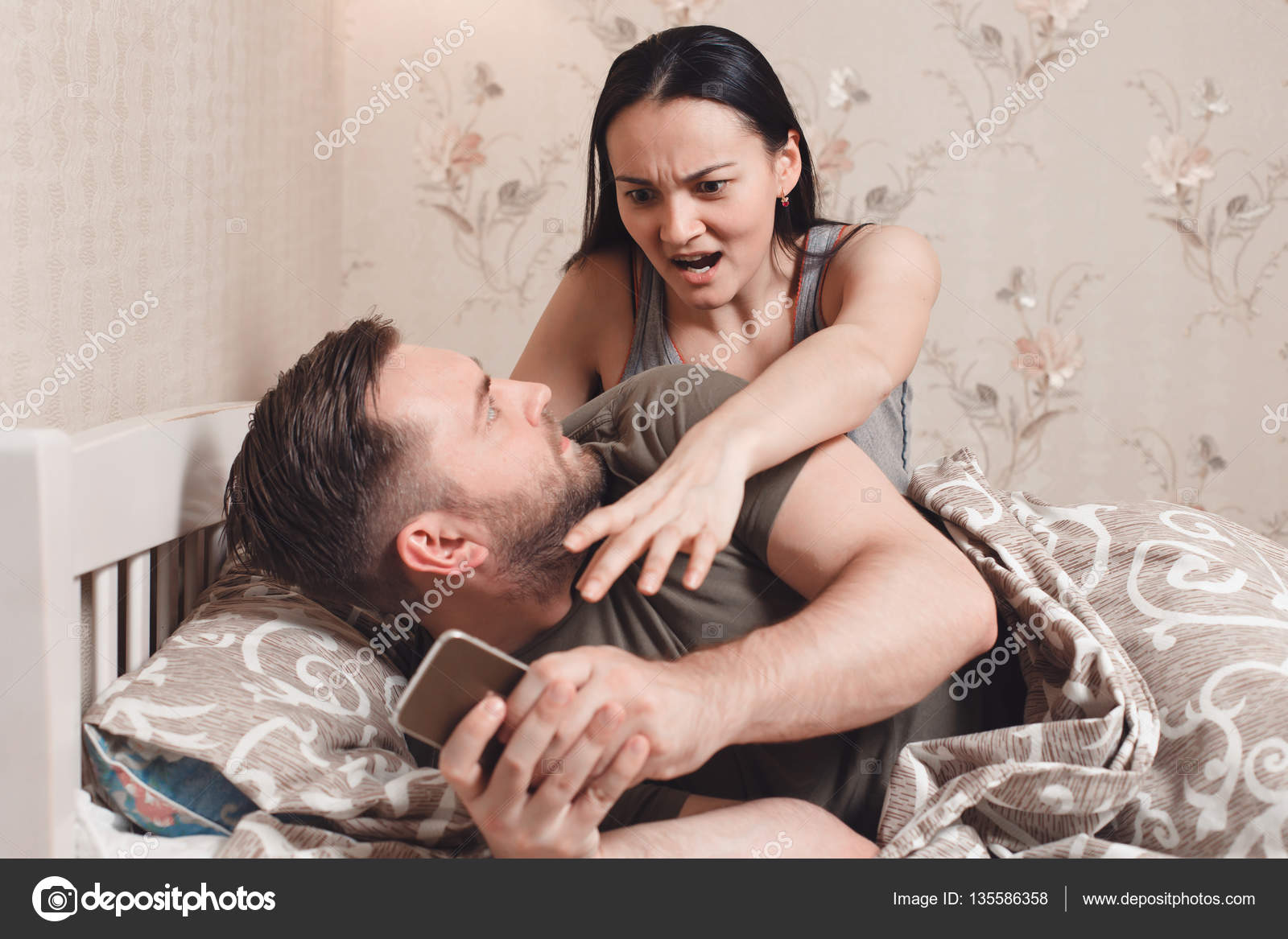 Husband watching phone of wife Stock Photo by ©Nomadsoul1 135586358