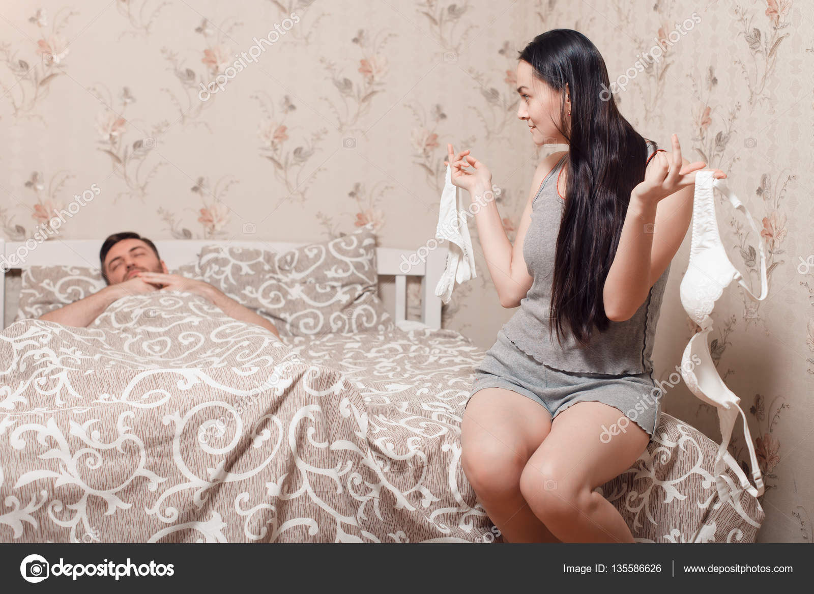 Woman with underwear and sleeping man Stock Photo by ©Nomadsoul1