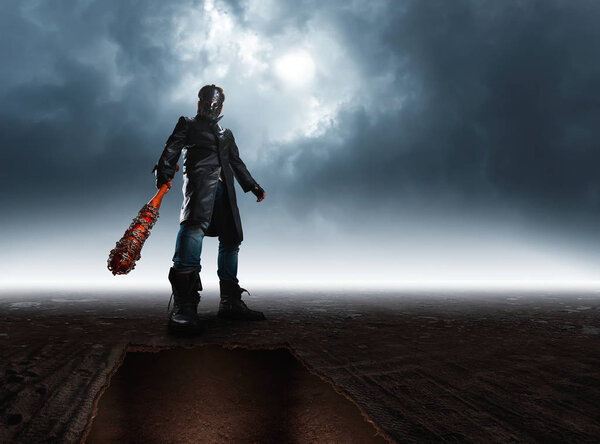 Bloody maniac in hockey mask with bat