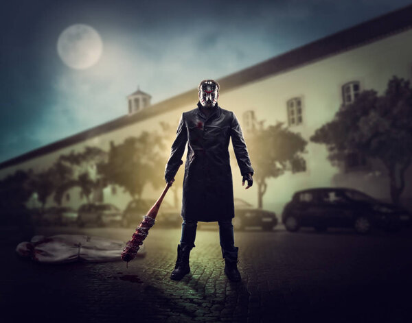 Serial murderer holding bloody bat