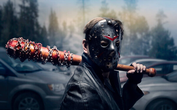 Bloody maniac in hockey mask with bat