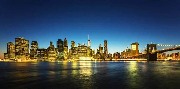 Cityscape of Manhattan skyscrapers at night, New York City, USA