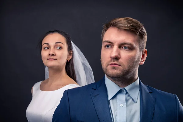 Groom in suit and bride in white dress — Stock Photo, Image