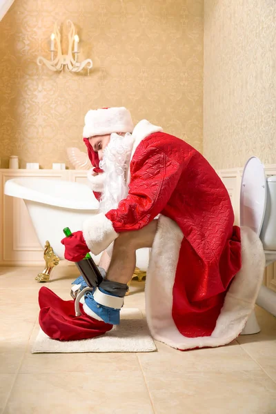 Santa Claus sitting on toilet — Stock Image Santa Claus sitting on toilet Stock Picture