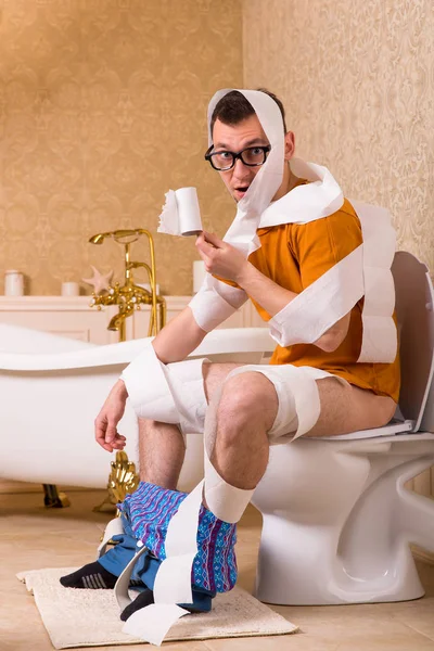 Man on toilet bowl — Stock Photo, Image