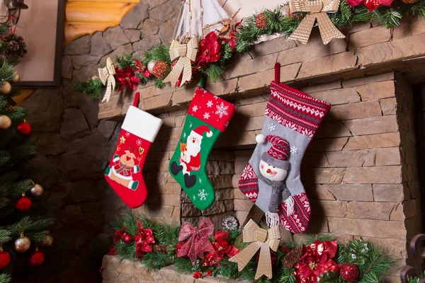 Fireplace decorated with christmas socks — Stock Photo, Image