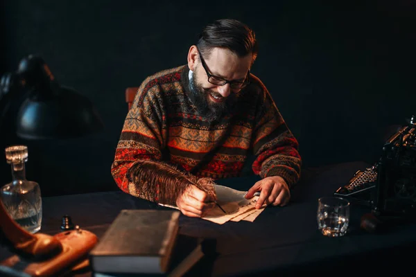 Bearded writer writing with feather — Stock Photo, Image