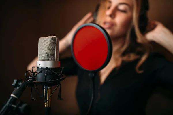 Female singer recording song — Stock Photo, Image