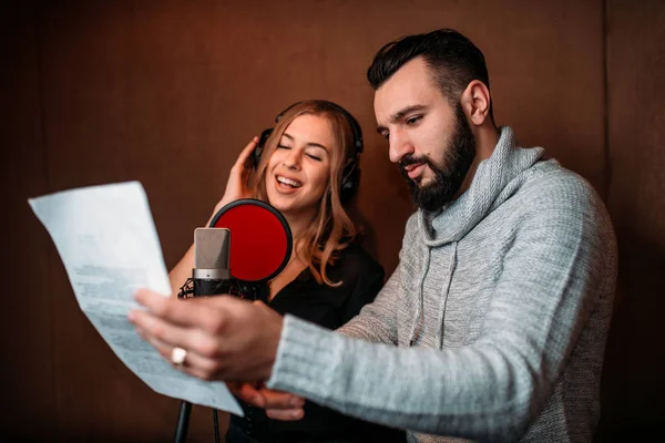 Sound producer with female singer — Stock Photo, Image