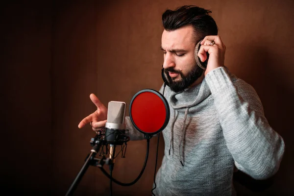 Male singer recording song — Stock Photo, Image