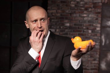 professional agent holding toy duck clipart