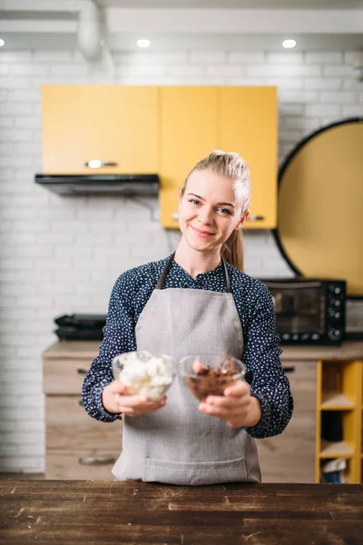 Woman holding bowls with ingredients — Stock Photo, Image