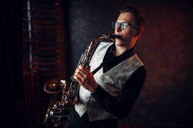 male musician playing saxophone clipart