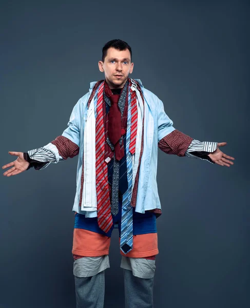 Man dressed in many clothes — Stock Photo, Image