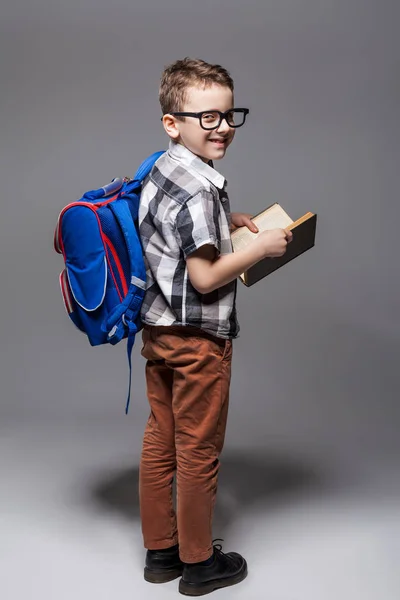 Schoolboy reading book — Stock Photo, Image