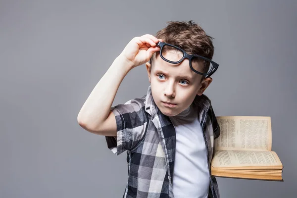 Schoolboy holding book — Stock Photo, Image