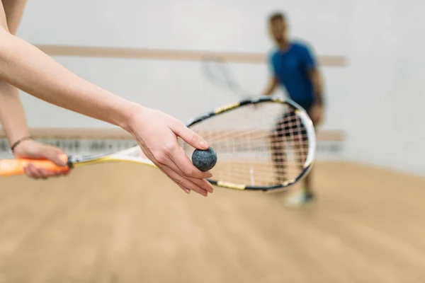 Man and woman playing squash — Stock Photo, Image
