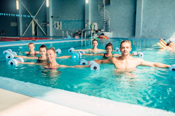 Aqua aerobics workout with dumbbells — Stock Photo, Image