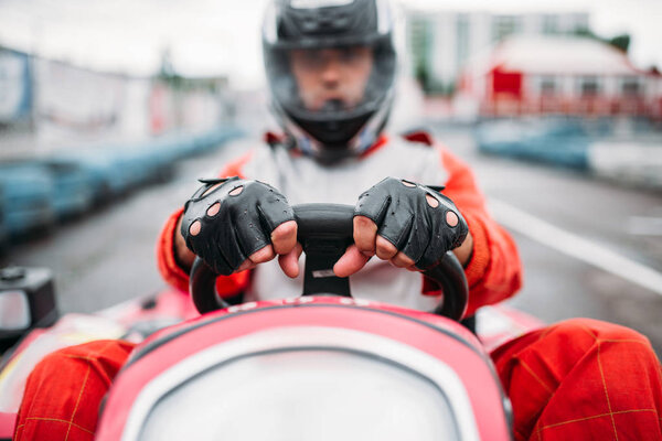 Karting racer wearing helmet 