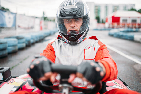 Karting racer wearing helmet 