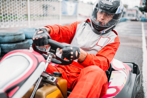 Karting racer wearing helmet 