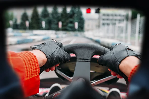 Hands of karting driver on steering wheel — Stock Photo, Image